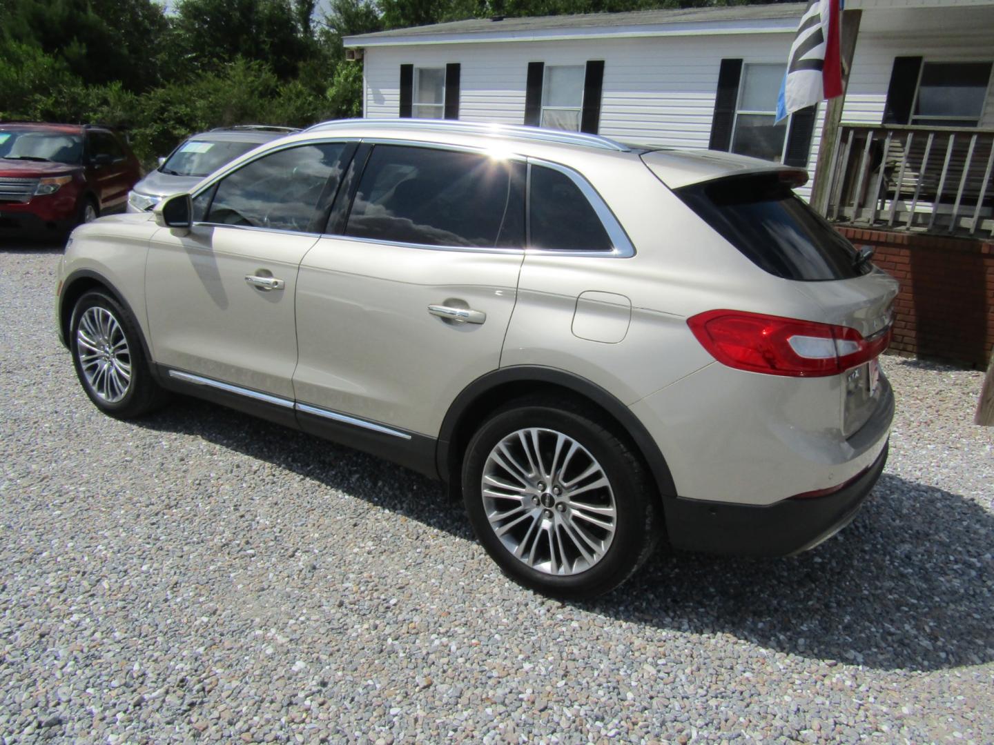 2017 Gold /Tan Lincoln MKX Reserve (2LMPJ6LR8HB) with an 3.7L V6 DOHC 24V engine, Automatic transmission, located at 15016 S Hwy 231, Midland City, AL, 36350, (334) 983-3001, 31.306210, -85.495277 - Photo#5